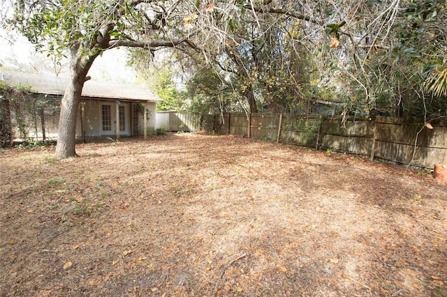 view of yard with french doors