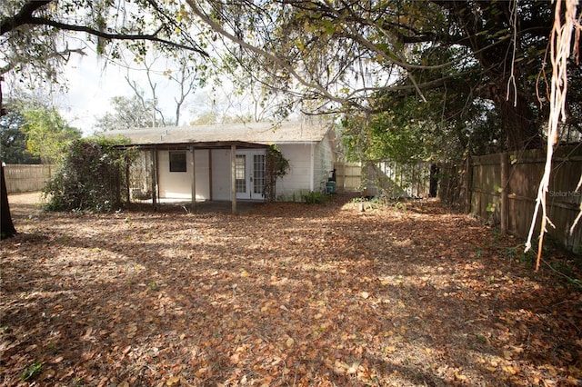 rear view of property featuring french doors