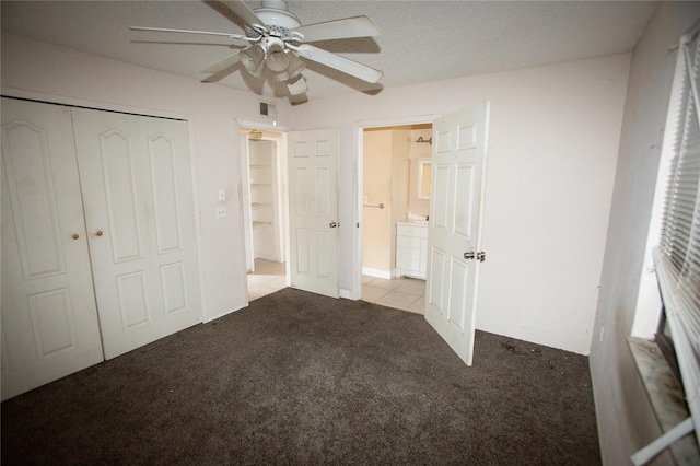 unfurnished bedroom featuring ceiling fan, light carpet, and a closet