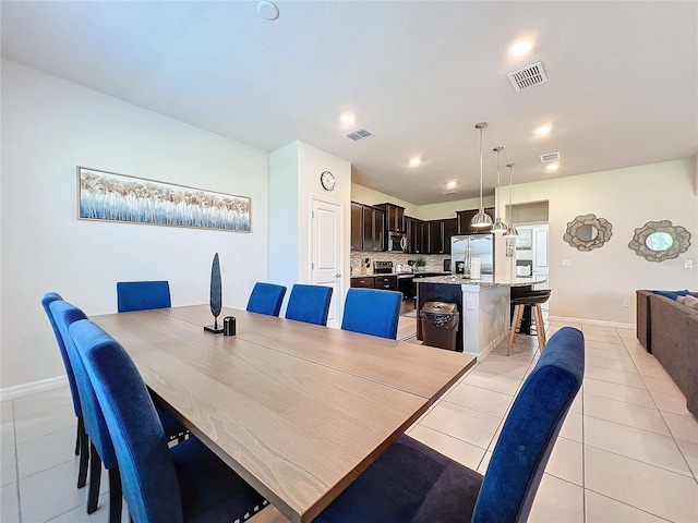 dining room featuring light tile patterned floors