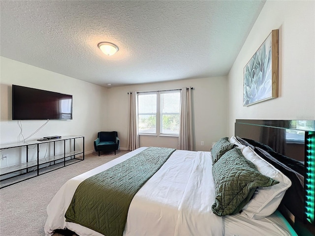 carpeted bedroom with a textured ceiling