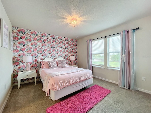 carpeted bedroom with a textured ceiling