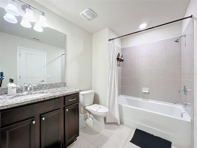 full bathroom with tile patterned flooring, a textured ceiling, shower / tub combo, vanity, and toilet