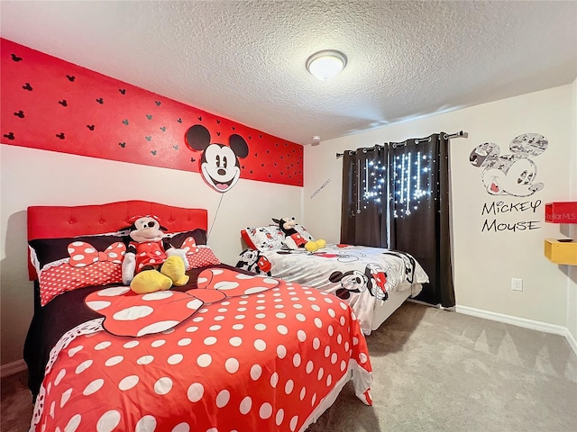 bedroom with carpet floors and a textured ceiling