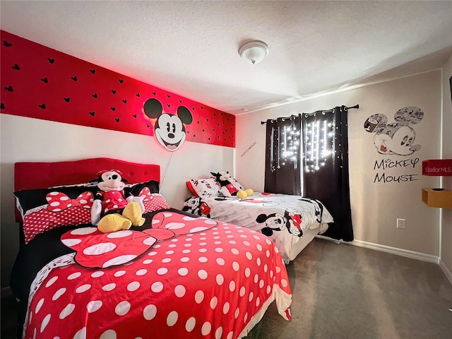 carpeted bedroom featuring a textured ceiling