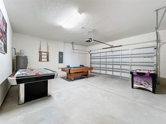 garage with a garage door opener, electric panel, and water heater