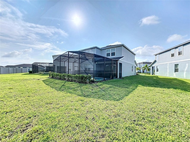 view of yard featuring glass enclosure