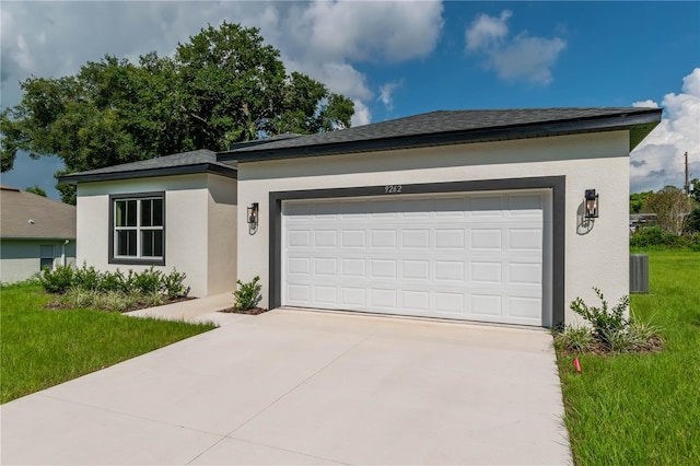 single story home featuring driveway, stucco siding, and an attached garage