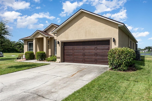 view of front of home with central AC unit, a garage, and a front lawn