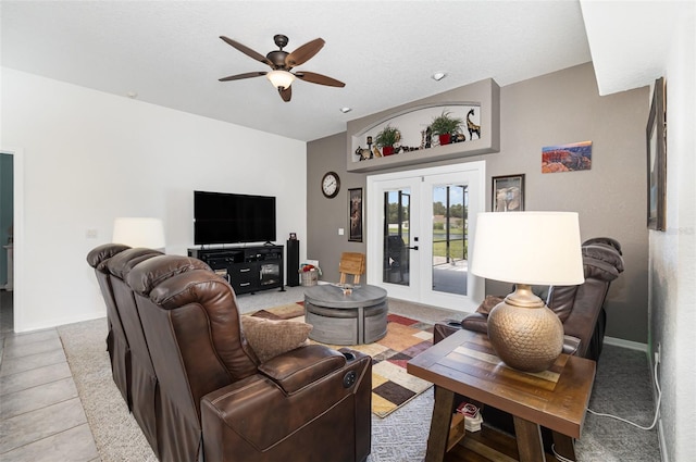 living room with ceiling fan and french doors