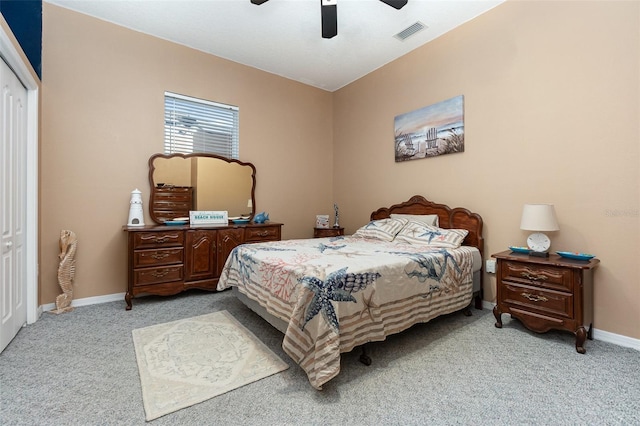 carpeted bedroom featuring a closet and ceiling fan