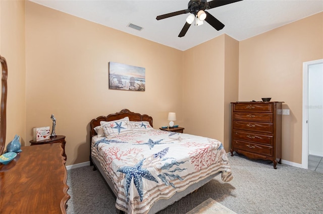 bedroom with ceiling fan and light colored carpet