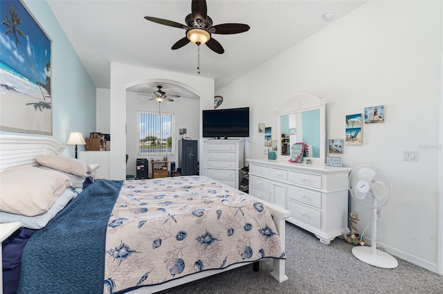 bedroom featuring vaulted ceiling, ceiling fan, and carpet floors