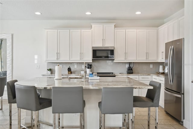 kitchen featuring appliances with stainless steel finishes and white cabinetry