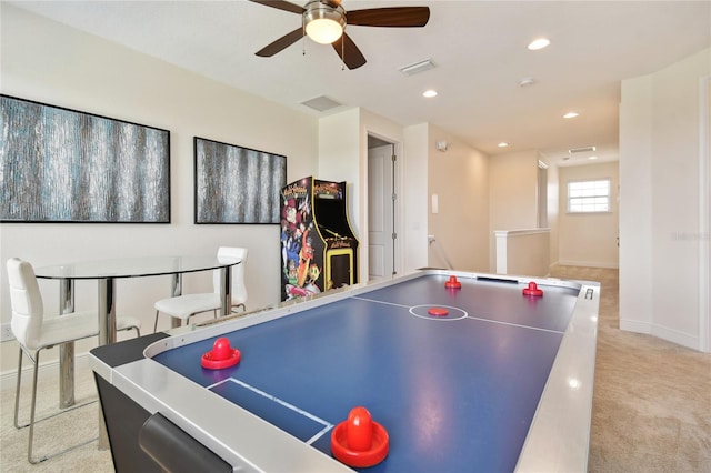 recreation room featuring ceiling fan and light colored carpet