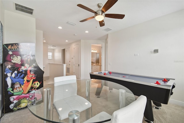 playroom with light carpet and ceiling fan