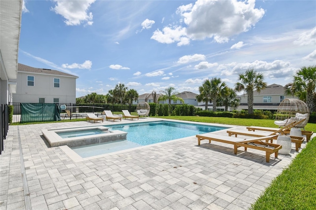 view of swimming pool with an in ground hot tub and a patio area