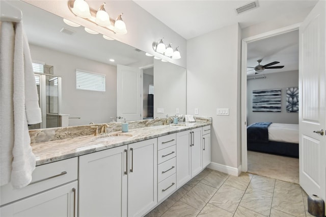 bathroom with ceiling fan, vanity, and an enclosed shower