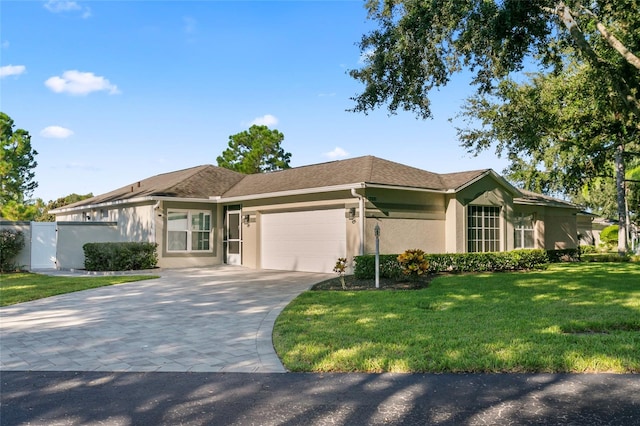 ranch-style home with a front yard and a garage