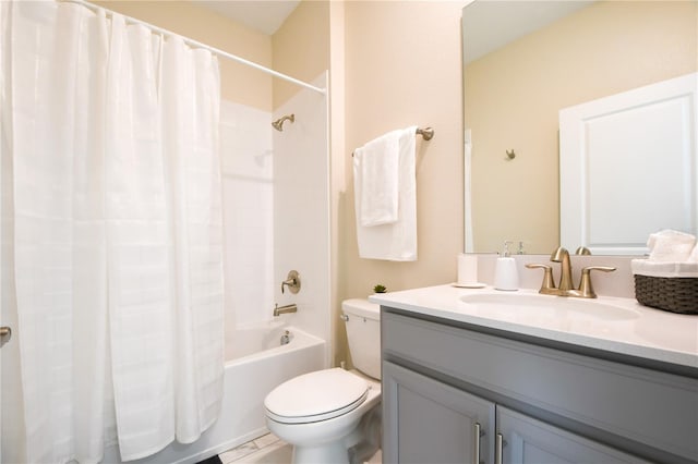 full bathroom featuring shower / tub combo, vanity, and toilet