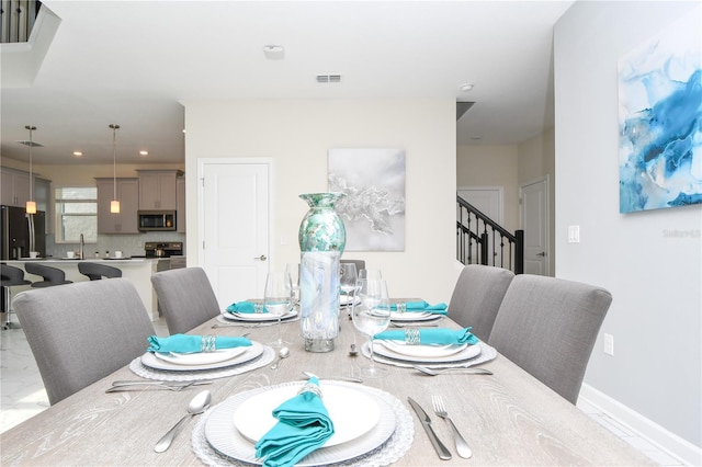 dining area featuring sink