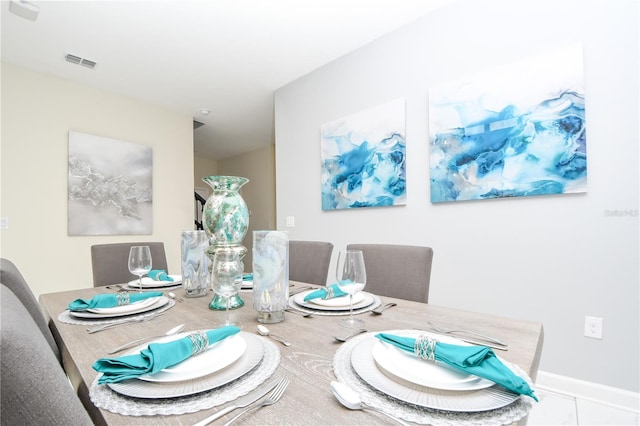 dining space with tile patterned floors