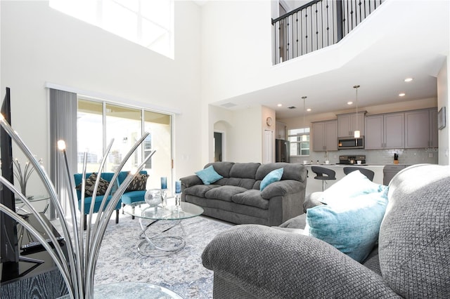 living room with a towering ceiling