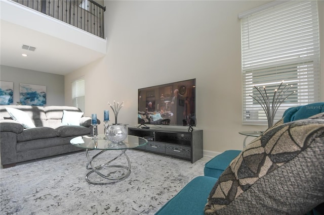 living room featuring a high ceiling