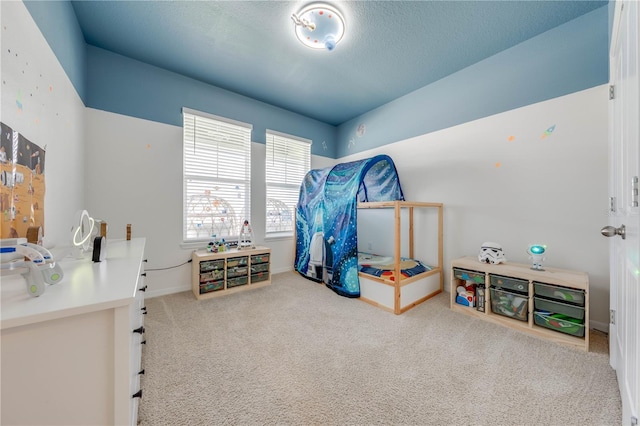 bedroom featuring carpet floors and a textured ceiling