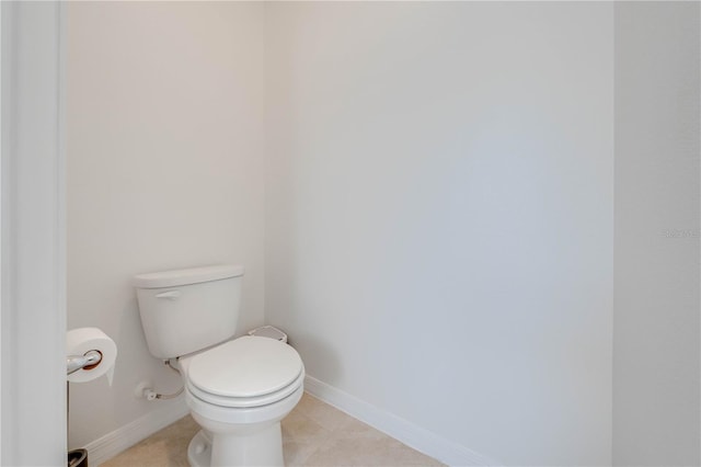 bathroom featuring toilet and tile patterned floors