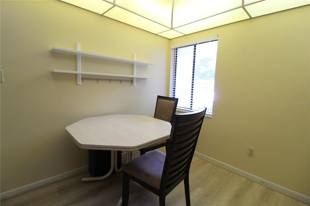 dining room with wood-type flooring