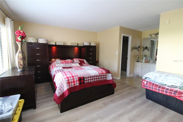 bedroom with light hardwood / wood-style floors