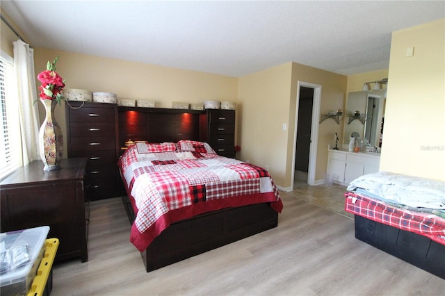 bedroom with light hardwood / wood-style flooring