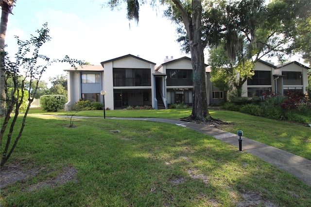 view of front of home with a front lawn