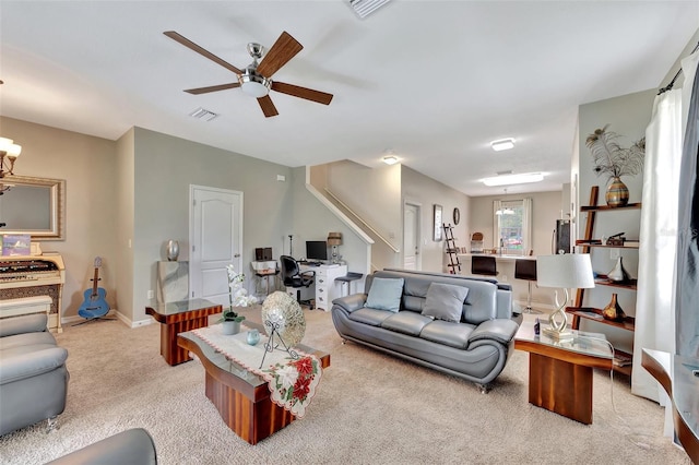 carpeted living room featuring ceiling fan