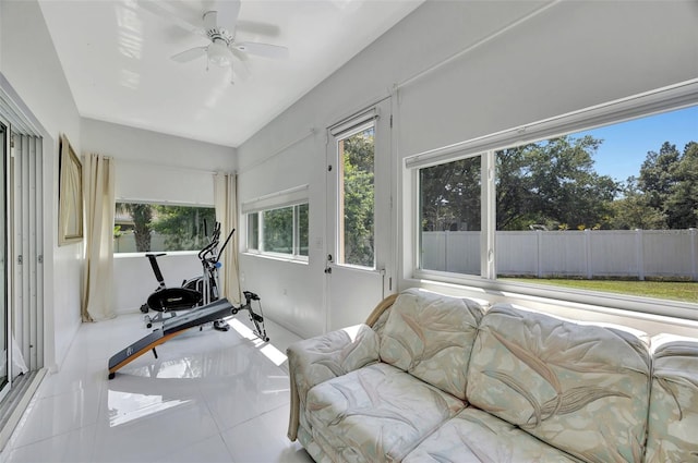 sunroom featuring ceiling fan