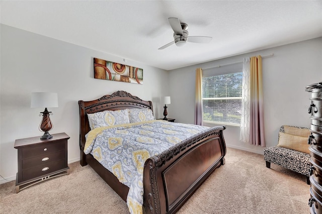 bedroom with light carpet and ceiling fan