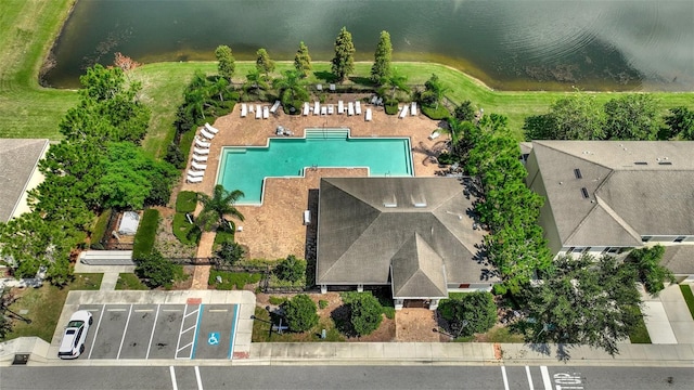 birds eye view of property featuring a water view