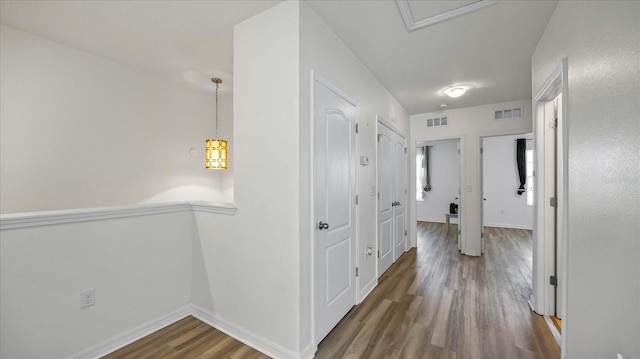 hallway featuring dark hardwood / wood-style floors