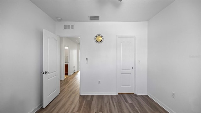 unfurnished bedroom featuring wood-type flooring