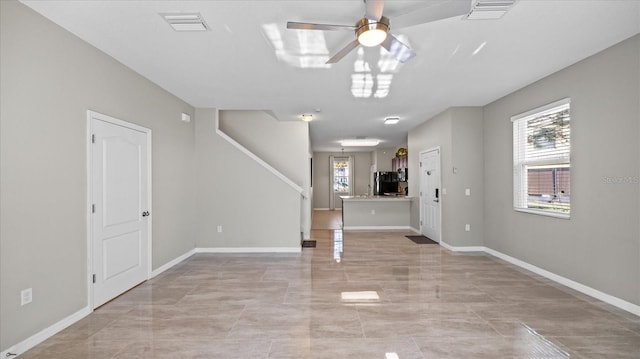 entrance foyer featuring ceiling fan