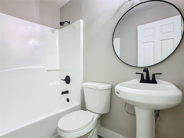 bathroom featuring toilet and  shower combination