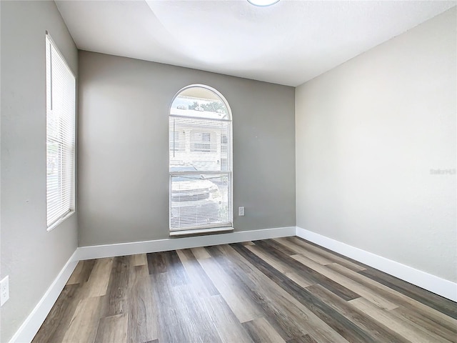 empty room with wood-type flooring