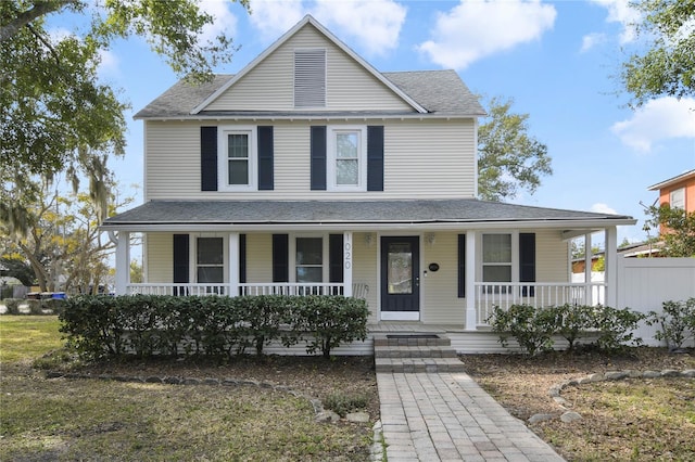 country-style home with a porch