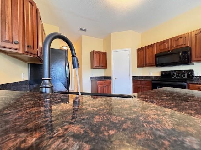 kitchen with black appliances