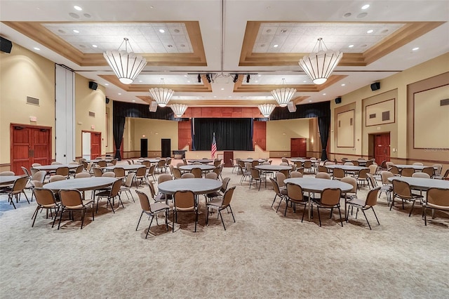 carpeted dining space with a towering ceiling and a tray ceiling