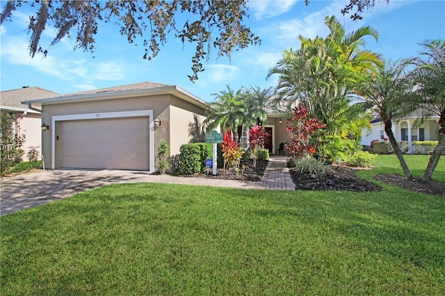 single story home with a garage and a front lawn