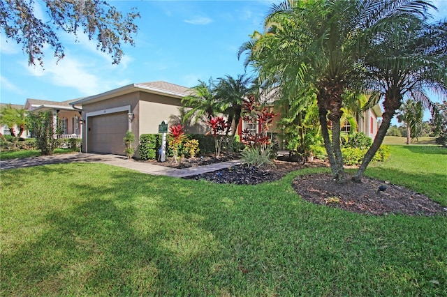 view of front of property featuring a front lawn and a garage