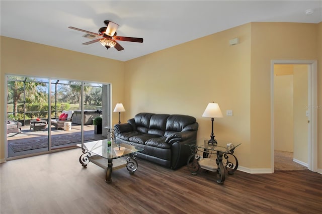 living room with hardwood / wood-style flooring and ceiling fan