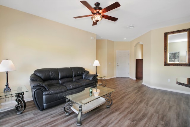 living room featuring ceiling fan and hardwood / wood-style flooring